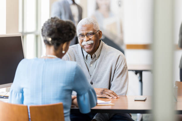 istock Senior man gets help setting up deposit accounts for grandchildren 1152654541
