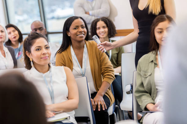istock Diverse group attends town  hall Q and A session 1152654657