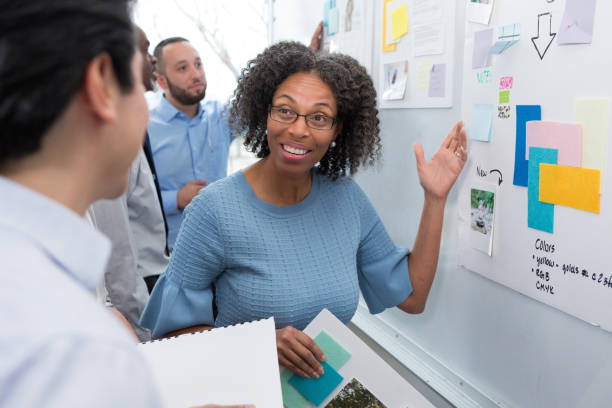 istock Confident businesswoman presents ideas 1152654899
