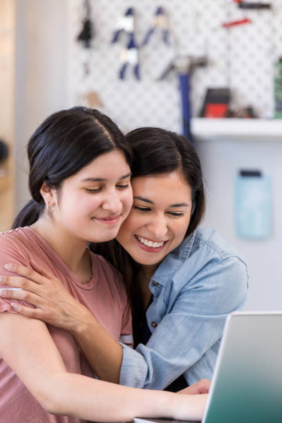 istock Hispanic aunt is overjoyed about niece's scholarship 1152654929