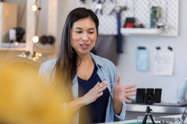 Hispanic mom video chats with daughter in college