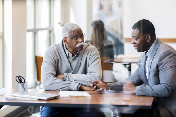 istock Senior banking customer talks with bank officer 1152654990