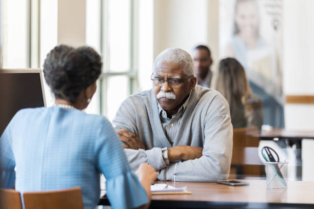 istock Concerned bank customer talking with loan officer 1152655020