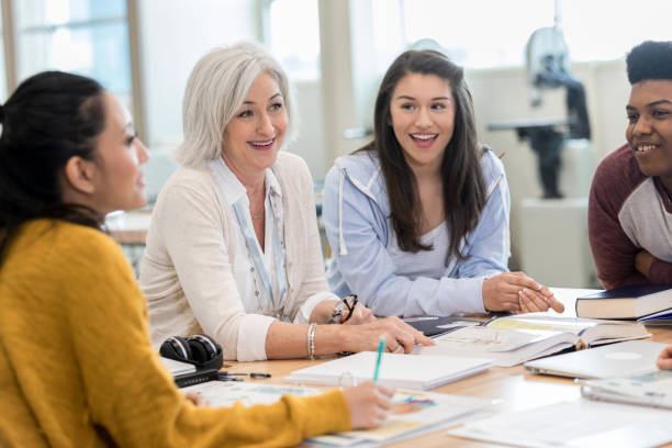 istock Teacher meets with a group of students 1152655060
