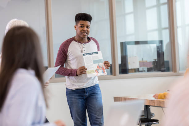 istock Male high school student presents report to class 1152655074