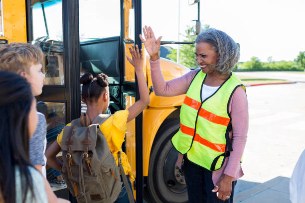istock Student shares high five with school bus driver 1152655150