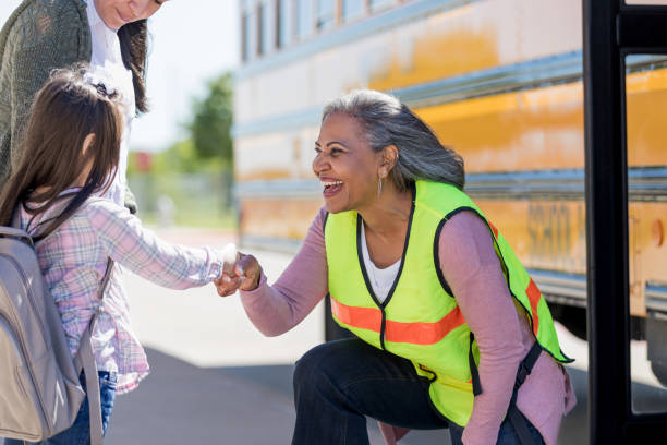 istock Mature school bus driver giving fist bump 1152655337