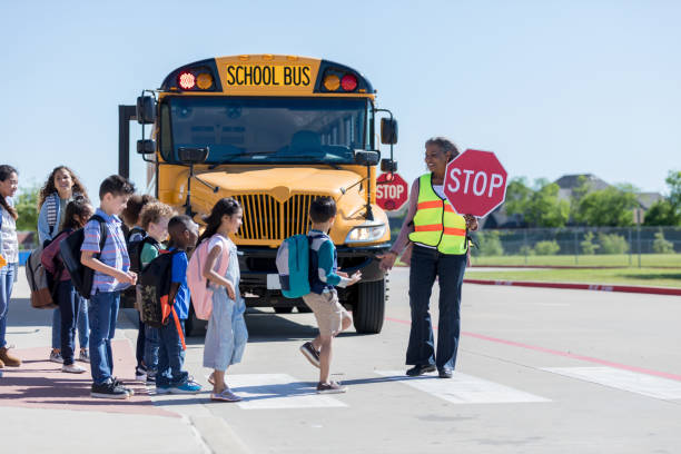 istock School children crossing crosswalk 1152655355