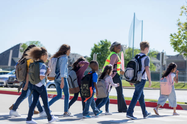 istock School children cross crosswalk 1152655387