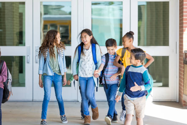 istock Group of children leaving school 1152655407
