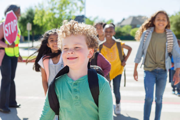 istock Cheerful diverse group of school children cross safely 1152655582