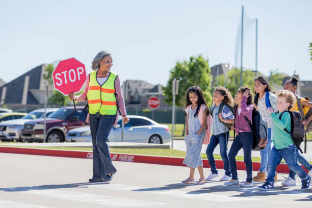 istock Children confidently follow crossing guard 1152655645