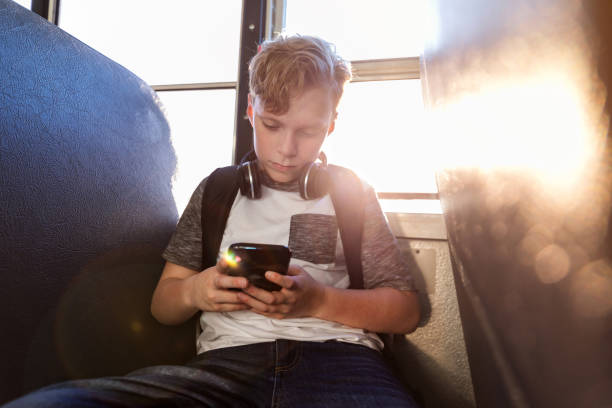 istock Independent young male student sits alone on bus 1152656324