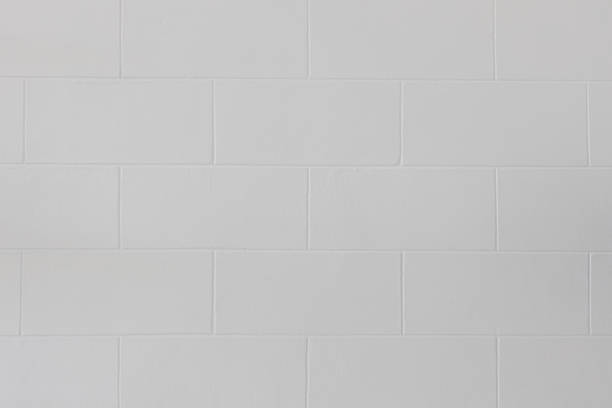 istock Close up of modern white block brick wall or floor texture background. 1152656398