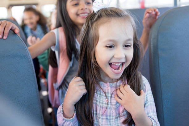 istock Restless children line up in school bus 1152656414