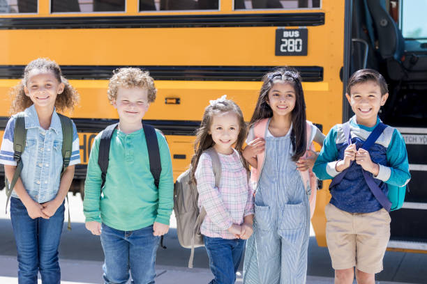 istock Group of school children look excitedly at camera 1152656448