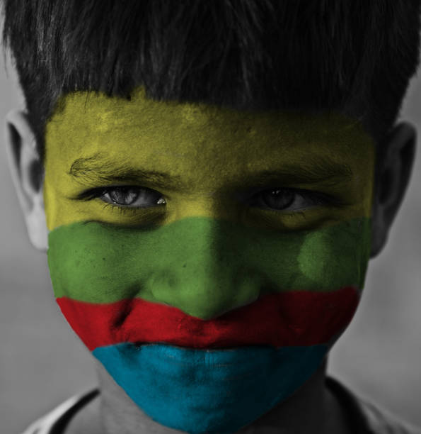 istock Colourful paints painted on a kid's face 1152656487