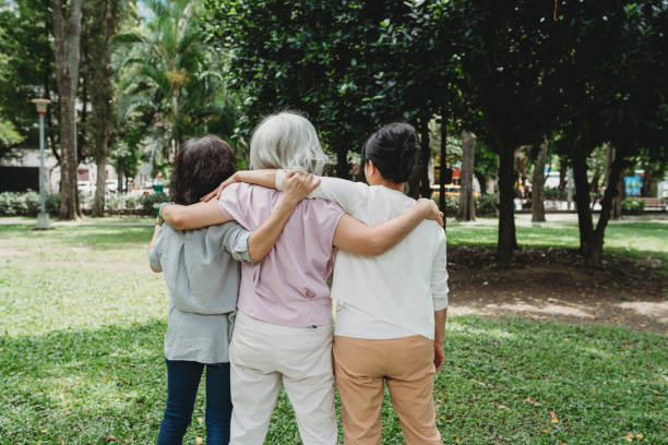 istock Three ladies together at the park - rear view 1152656864