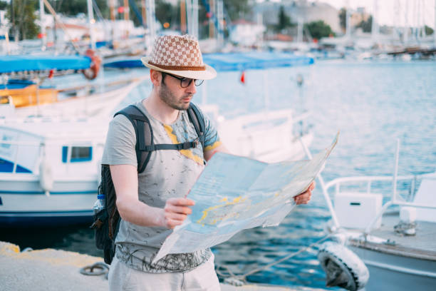 istock Tourist Man Looking at Map 1152657463