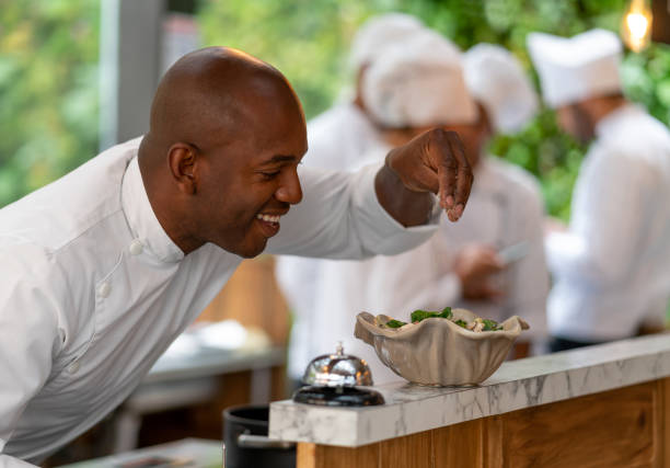 istock Chef decorating a plate of food at a restaurant 1152658682