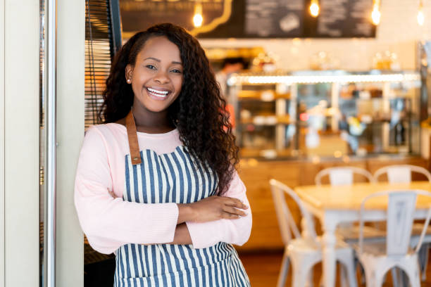 istock Friendly waitress looking happy working at a cafe 1152658706