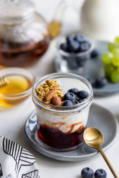 istock Oatmeal with nut, blueberry and yogurt on breakfast table 1152659511