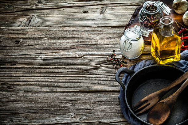 istock Cooking backgrounds: cooking ingredients and utensils on rustic wooden table with copy space 1152659563