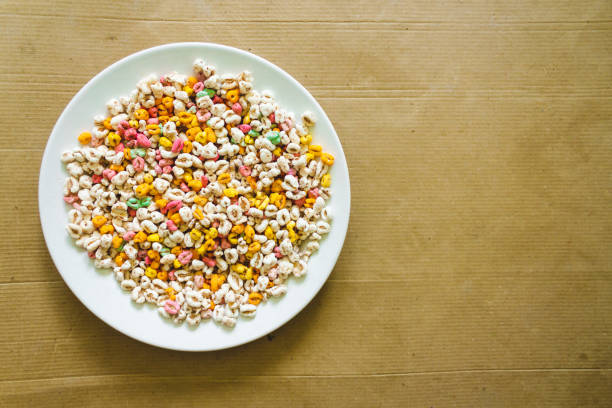 istock Top view of colored cereals in a white bowl 1152660334
