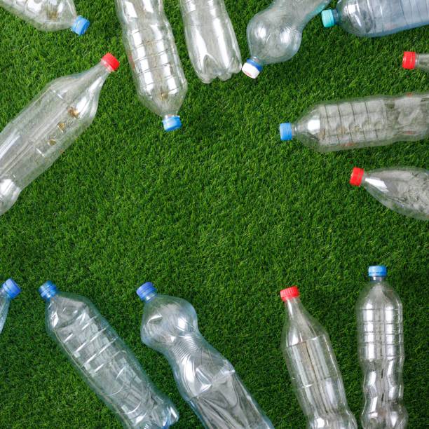 istock The concept of recycling plastic and environmental protection. Pet preforms for plastic bottles on the green grass. Artificial turf. 1152661607