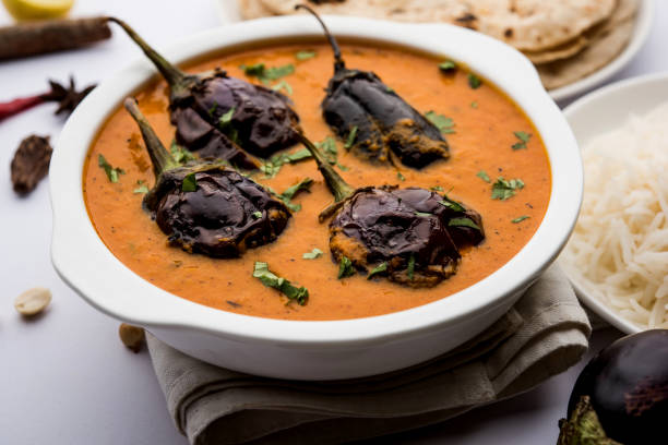 istock Baingan masala / Eggplant / brinjal curry served with chapati and rice, selective focus 1152662474