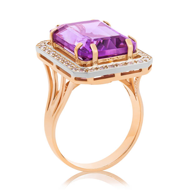 istock Beautiful golden ring with a large amethyst isolated on white background 1152663778