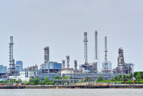 istock Large Oil Refinery Plant by the River 1152664364