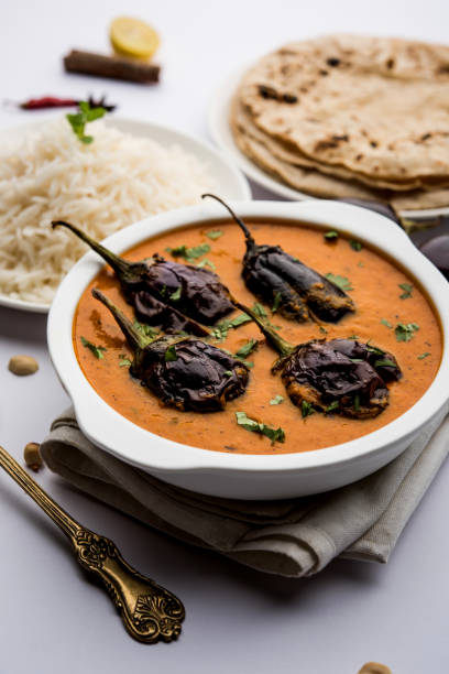 istock Baingan masala / Eggplant / brinjal curry served with chapati and rice, selective focus 1152664608