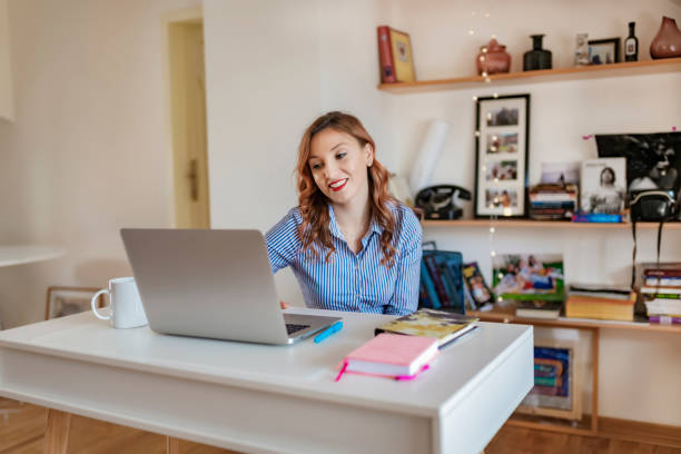 istock Pretty Woman Working On Laptop 1152666165