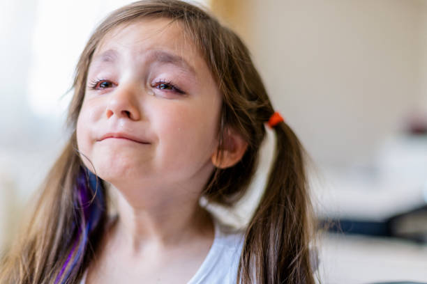 istock sad little girl crying deeply 1152668946