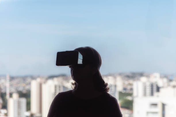 istock Woman with virtual reality glasses 1152670343