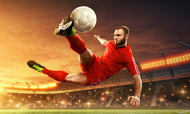 istock Soccer player kicks a ball. Action. Night soccer stadium. 1152675644