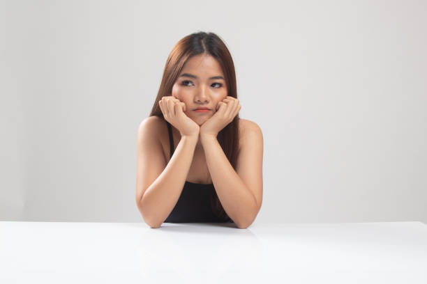istock Asian girl with sad emotion. 1152678253