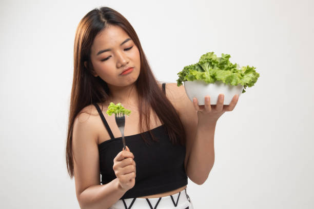 istock Asian woman hate salad. 1152678302