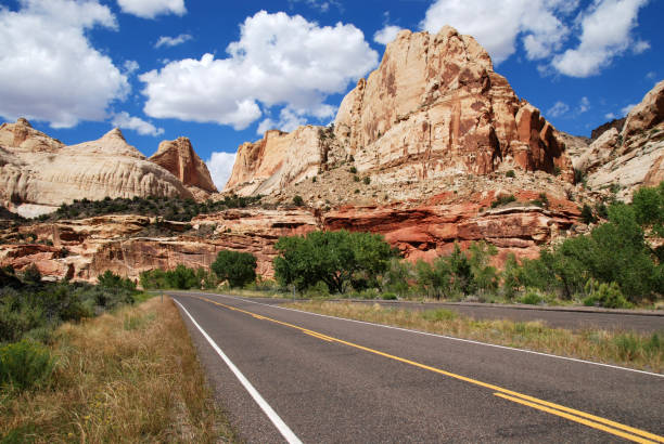 Capitol Reef National Park in Utah highway towards Capitol Dome in Capitol Reef National Park capitol reef national park stock pictures, royalty-free photos & images