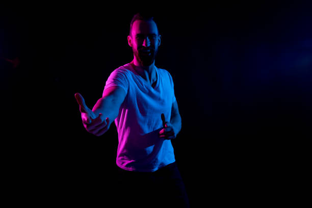 istock Handsome man in white tshirt with gel lighting 1152680754
