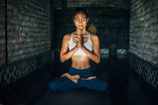 istock Young Woman Doing Yoga 1152680980