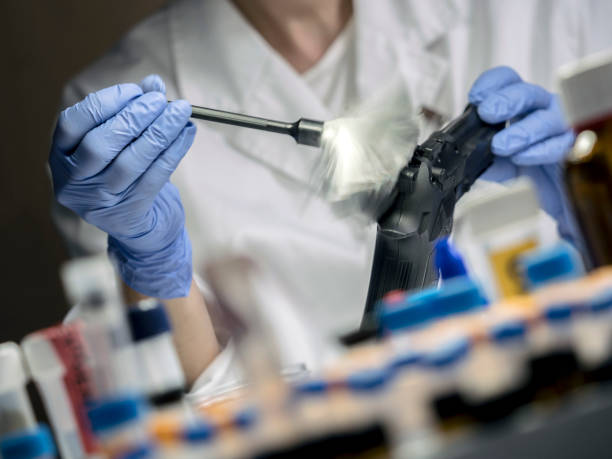 istock Expert Police takes samples in scientific laboratory, conceptual image 1152682784