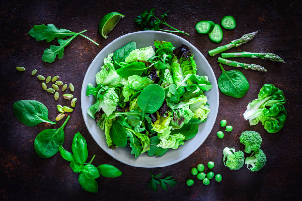 istock Vegan food: healthy fresh green salad shot from above 1152684728