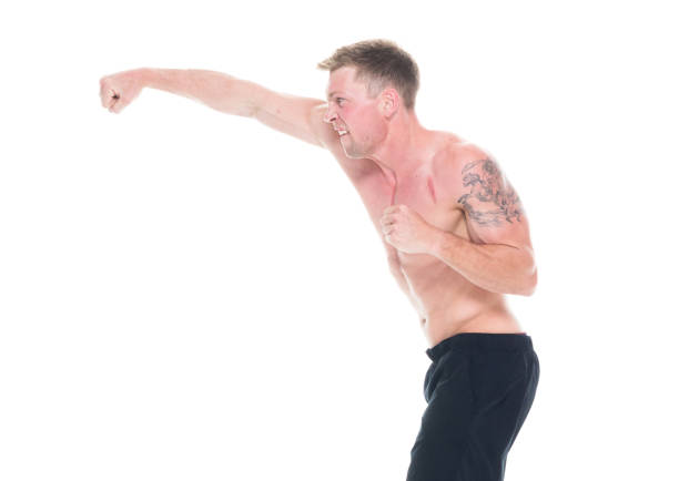 istock Handsome shirtless man in fighting stance, side view 1152685005