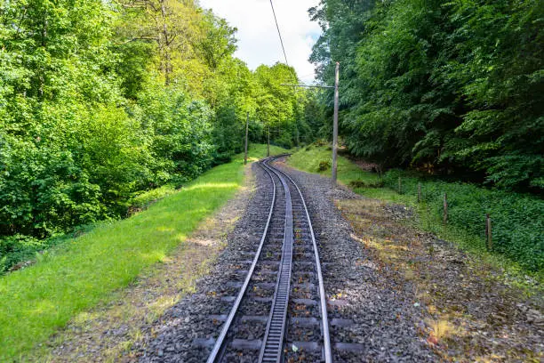 Cog railway tracks with an additional toothed rack located in the middle of the track to overcome large tilts.