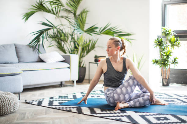 istock Woman practicing yoga at home 1152689391