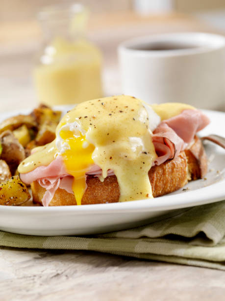 istock Eggs Benedict with Black Forest Ham and Hash Browns on Grilled French Bread 1152689739