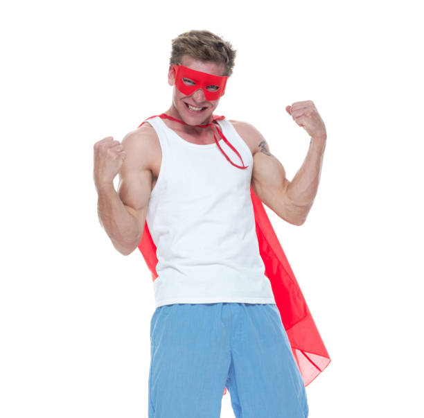 istock Man wearing pajamas and super hero cape 1152691240