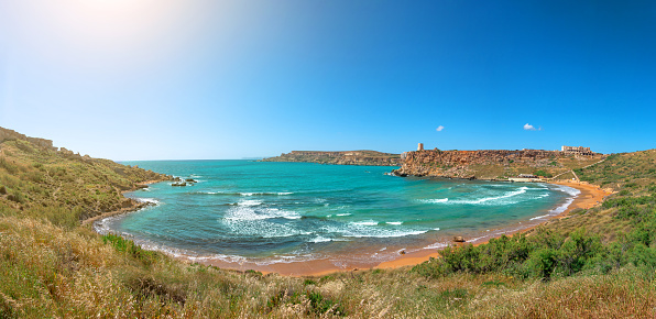 Panoramic view of a Ghajn Tuffieha Bay beach on Tuffieha region, Malta